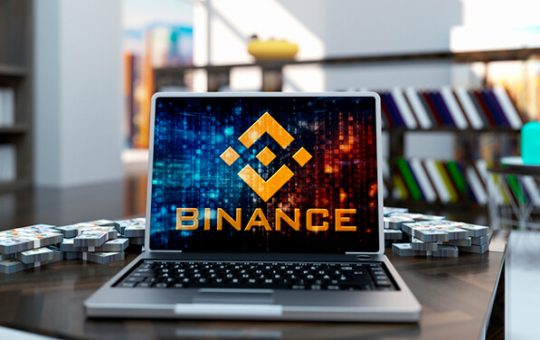 Image of laptop with Binance company logo