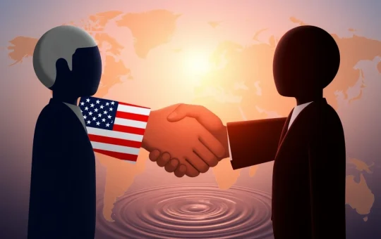 Two hands shaking, representing the US and EU, signifying a landmark US-EU Trade Deal that promises economic stability.