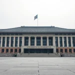 South Korean National Assembly building with a subtle digital crypto symbol overlay, representing the 2027 crypto tax law.